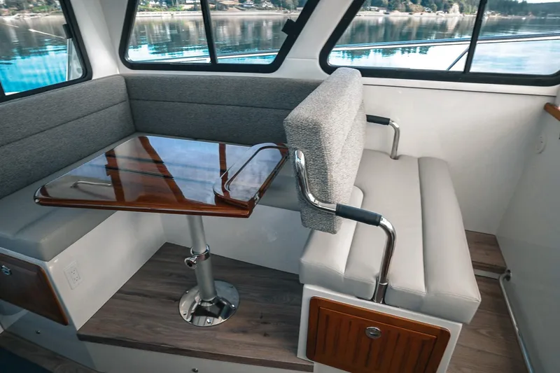 Slide: The Image of Interior of 2027 Lindell 41' boat with modern seating and wooden table. - 28