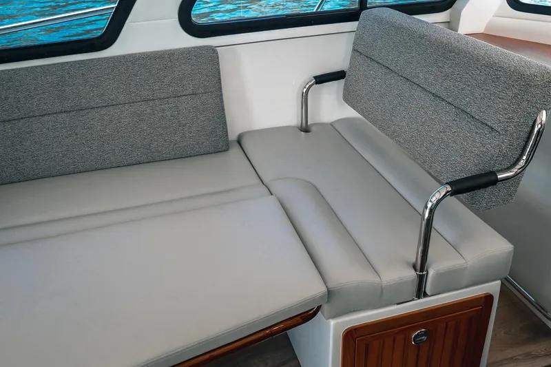 Slide: The Image of Modern interior seating on a 2027 Lindell 41' boat, featuring sleek gray upholstery. - 33