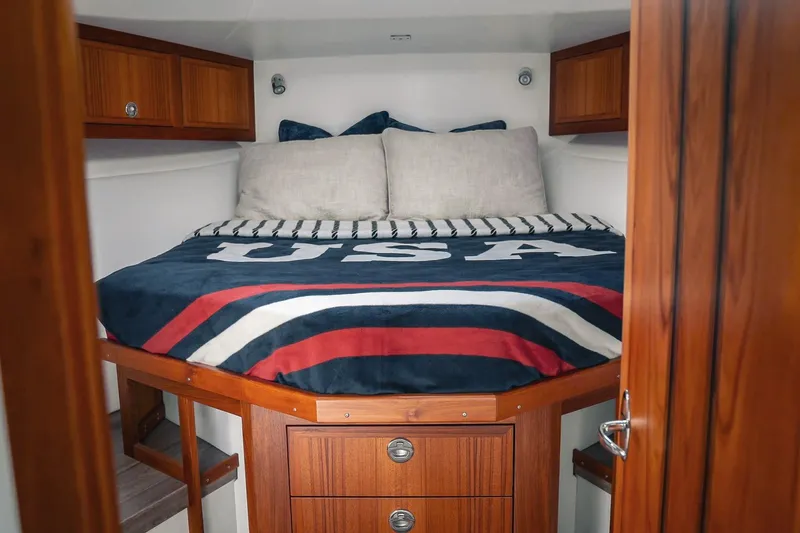 Slide: The Image of Cozy cabin interior of 2027 Lindell 41' boat with USA-themed bedding. - 38