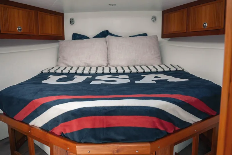 Slide: The Image of Cozy cabin bed in 2027 Lindell 41' boat with USA-themed bedding. - 39