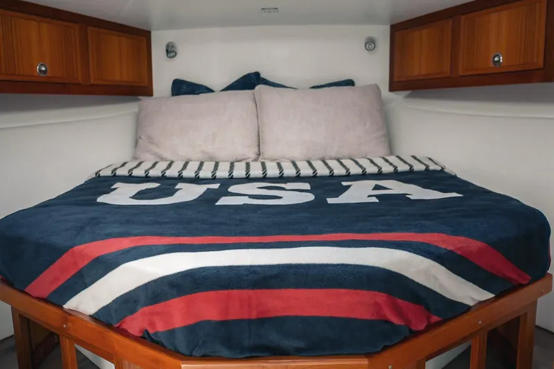 Slide: The Image of Cozy cabin bed in 2027 Lindell 41' boat with USA-themed bedding. - 40