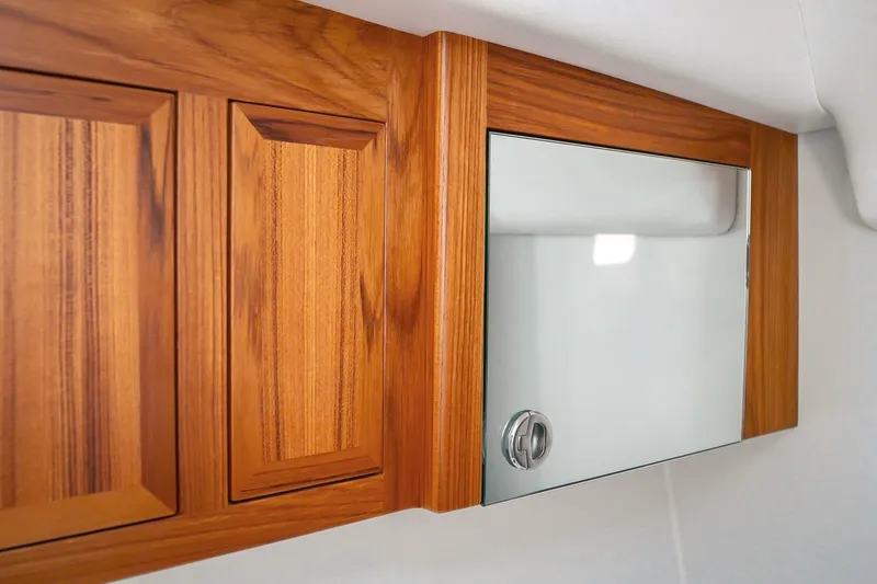 Slide: The Image of Wooden cabinet with mirrored door in 2027 Lindell 41' model interior. - 45