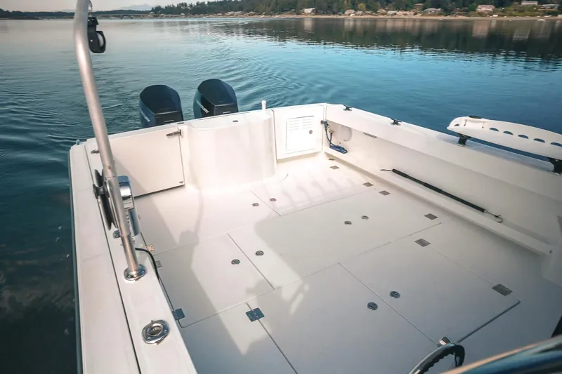 Slide: The Image of Lindell 41' 2027 boat deck with dual engines on calm water. - 9
