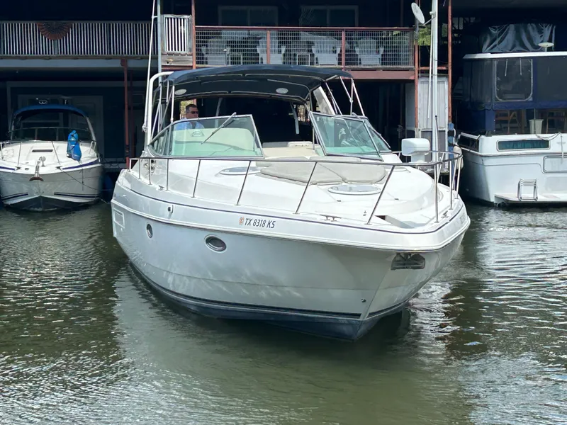 Slide: The Image of 1997 Cruisers Yachts 3575 Esprit docked in a marina, front view. - 10