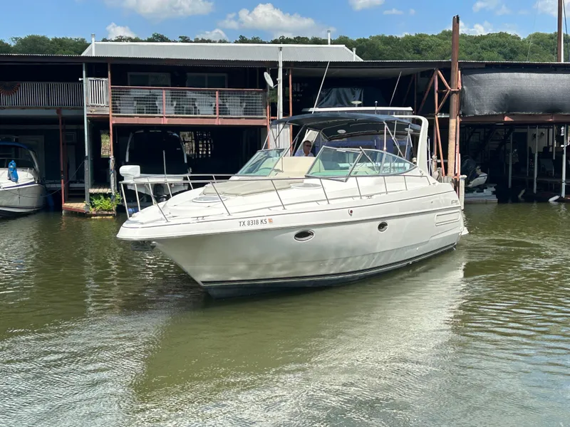 Slide: The Image of 1997 Cruisers Yachts 3575 Esprit docked at marina, sunny day, calm water. - 11