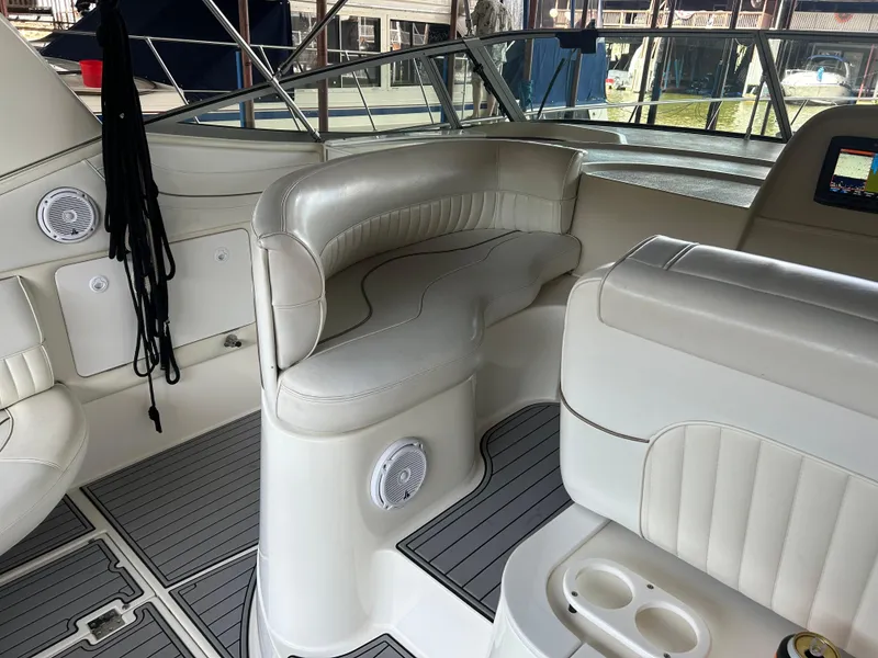 Slide: The Image of 1997 Cruisers Yachts 3575 Esprit interior with white seating and modern dashboard. - 15