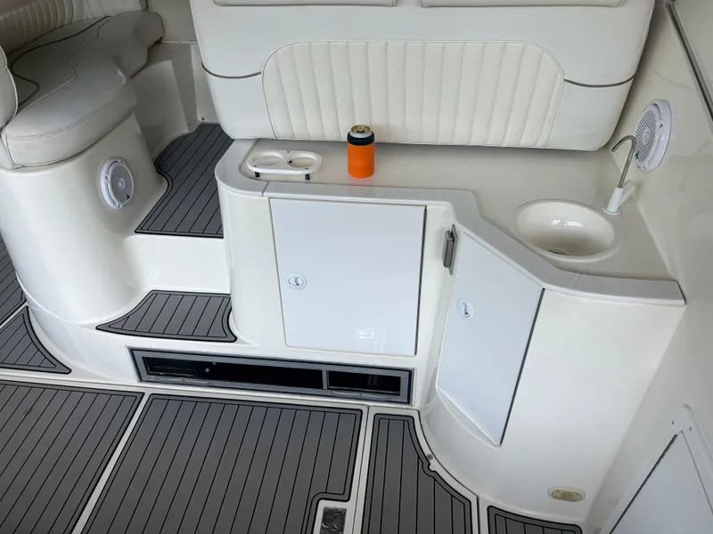 Slide: The Image of 1997 Cruisers Yachts 3575 Esprit interior with seating, sink, and cup holder. - 17