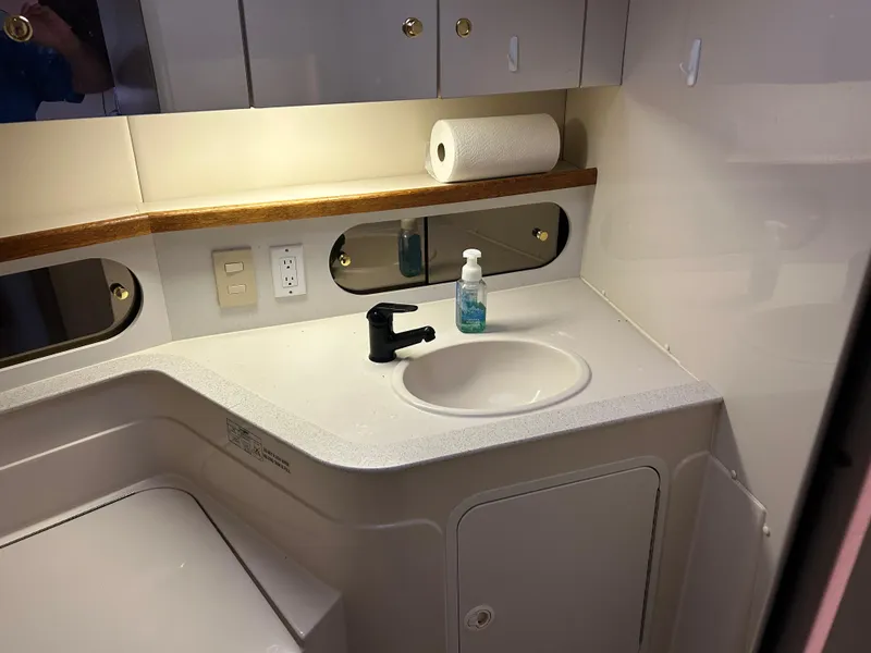 Slide: The Image of Bathroom sink area in 1997 Cruisers Yachts 3575 Esprit with soap and paper towel. - 18