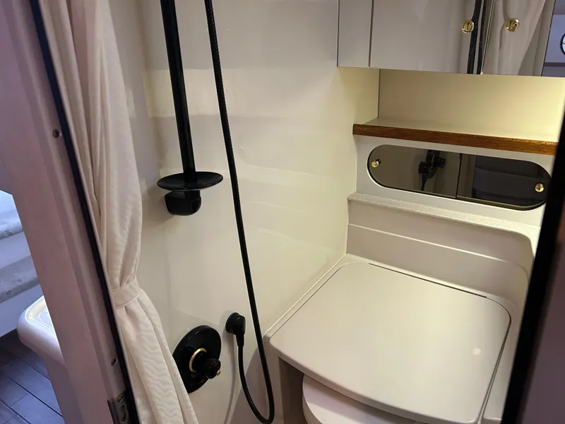 Slide: The Image of 1997 Cruisers Yachts 3575 Esprit bathroom with shower and sink area. - 19
