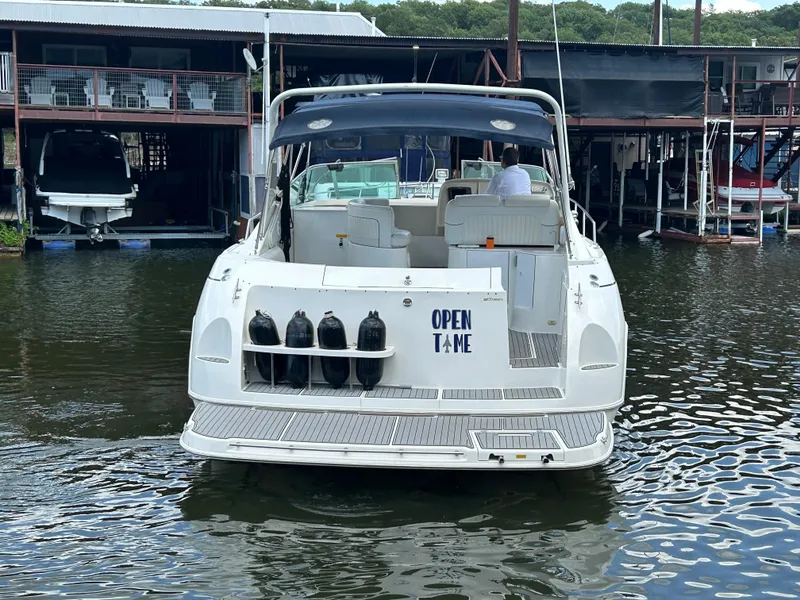 Slide: The Image of 1997 Cruisers Yachts 3575 Esprit docked at marina, rear view. - 2