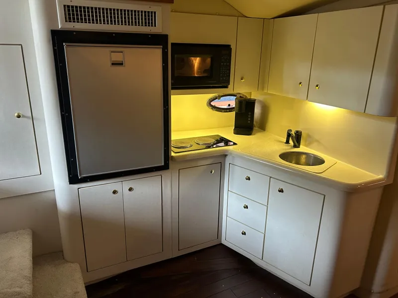 Slide: The Image of 1997 Cruisers Yachts 3575 Esprit galley with fridge, microwave, and sink. - 23