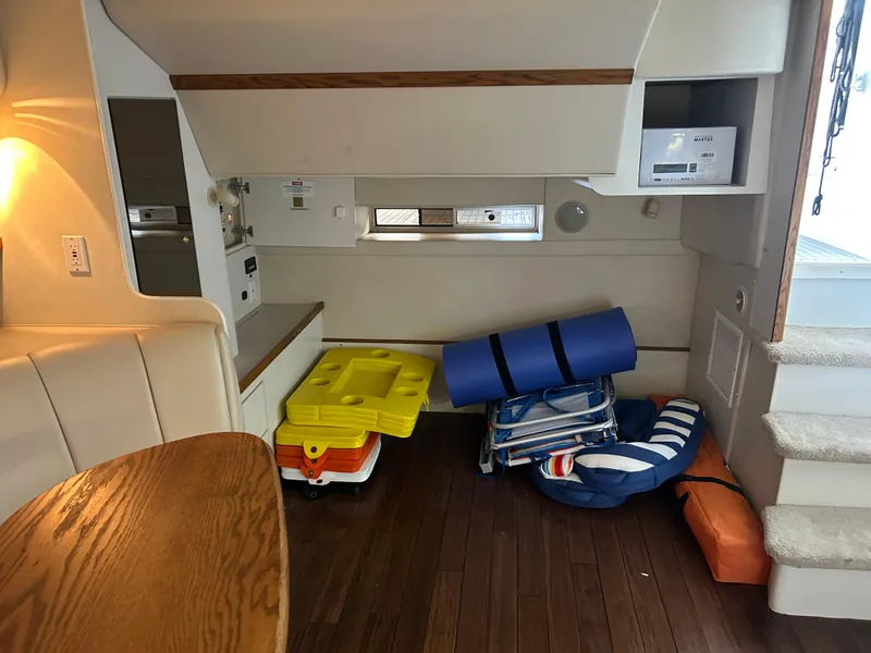 Slide: The Image of Interior of 1997 Cruisers Yachts 3575 Esprit with seating and storage items. - 24