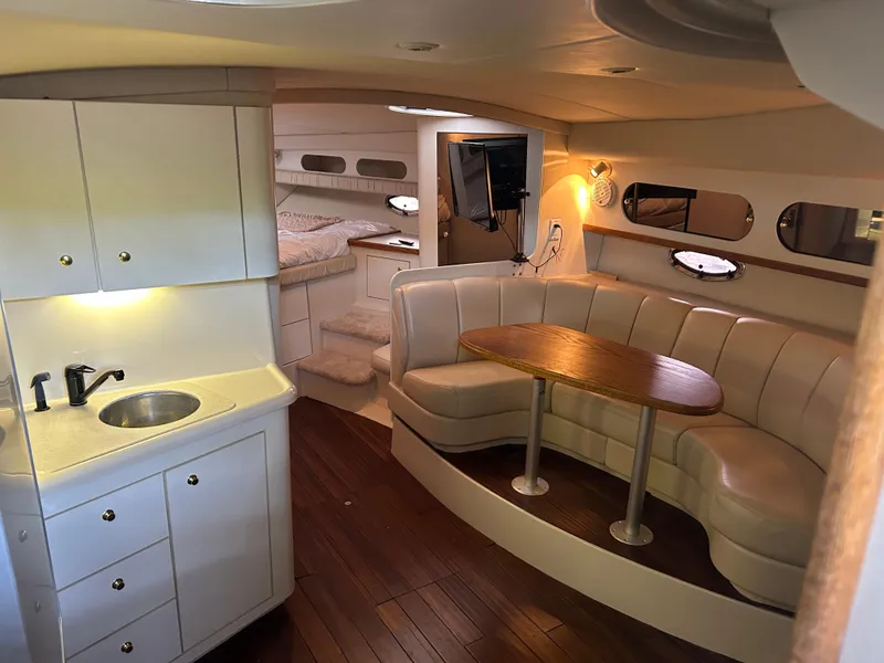 Slide: The Image of Luxurious interior of 1997 Cruisers Yachts 3575 Esprit with kitchenette and seating area. - 25