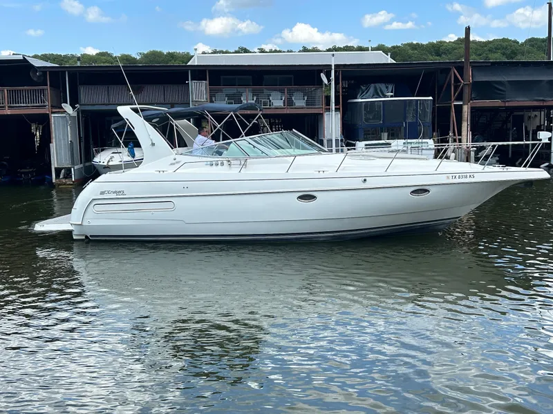 Slide: The Image of 1997 Cruisers Yachts 3575 Esprit docked at marina, calm water, clear sky. - 5