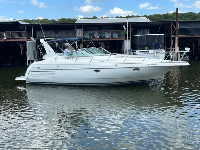 Slide: The Image of 1997 Cruisers Yachts 3575 Esprit boat docked on calm water. - 6