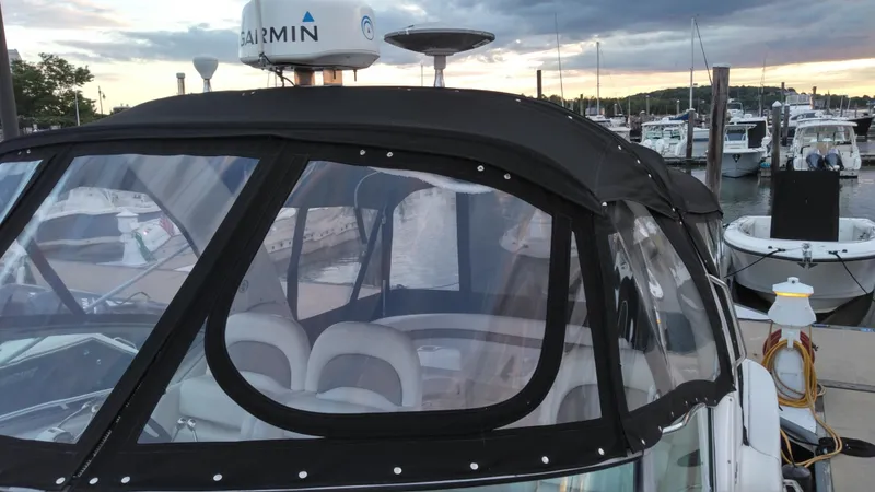 Slide: The Image of 2004 Sea Ray 340 Sundancer docked at a marina with Garmin radar. - 10