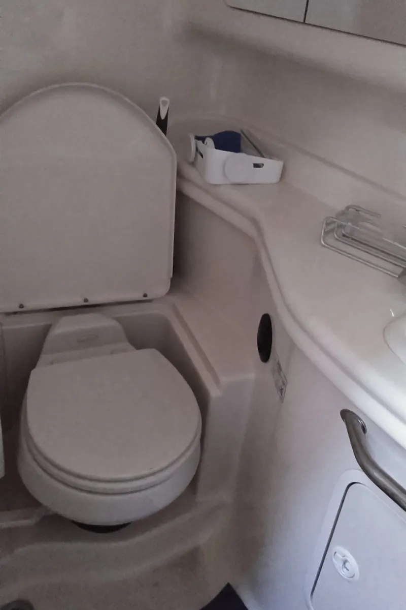 Slide: The Image of 2004 Sea Ray 340 Sundancer boat bathroom with toilet and sink - 21