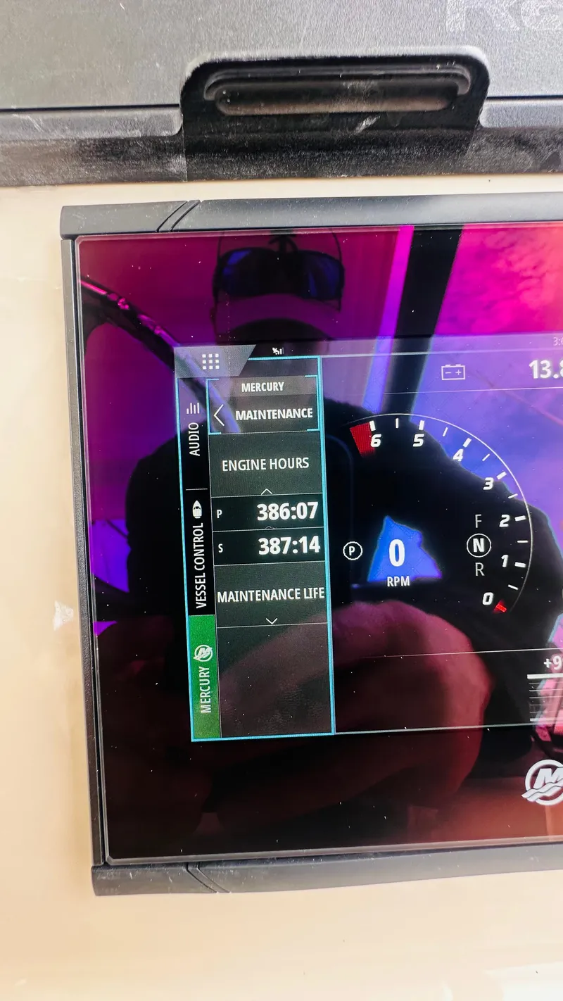 Slide: The Image of Display screen showing engine hours and RPM on a 2021 Boston Whaler 325 Conquest. - 15