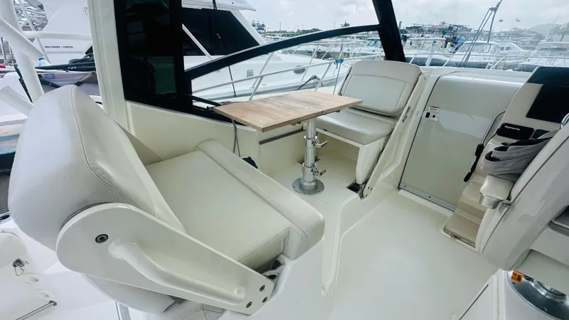 Slide: The Image of Interior of 2021 Boston Whaler 325 Conquest with seating and table. - 6
