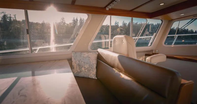Slide: The Image of Luxurious 2027 Lindell 42' yacht deck with open cabin door, docked by serene waters. - 10
