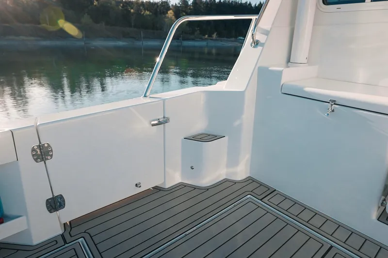 Slide: The Image of 2027 Lindell 42' boat deck with sleek design and scenic water view. - 14