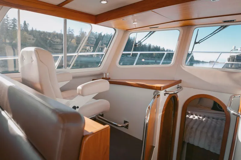 Slide: The Image of Interior of a 2027 Lindell 42' yacht with luxurious seating and panoramic windows. - 23