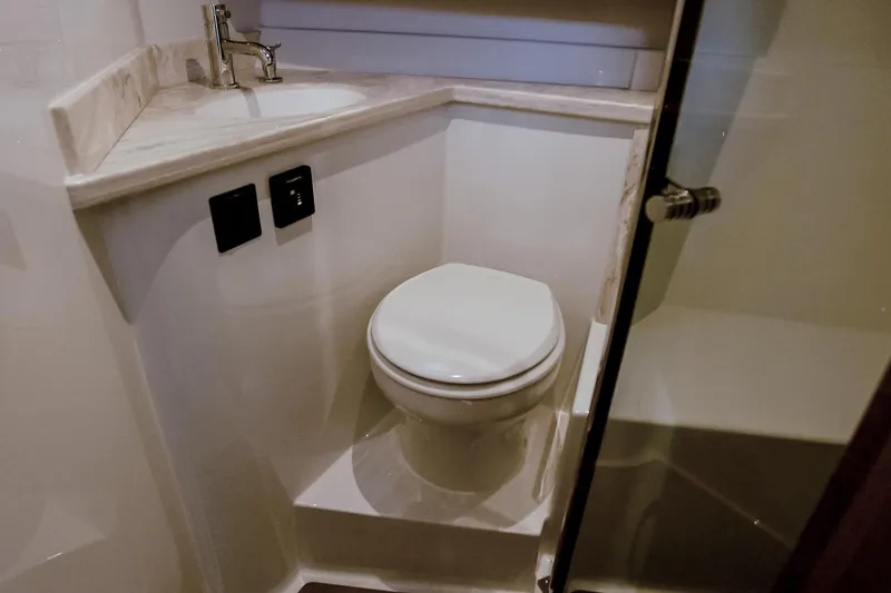 Slide: The Image of Modern bathroom in 2027 Lindell 42' yacht with toilet and sink. - 26