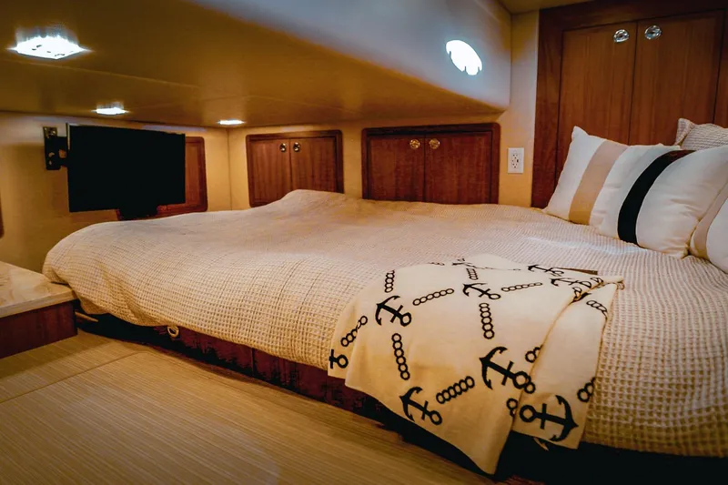 Slide: The Image of Luxurious cabin interior of 2027 Lindell 42' yacht with cozy bedding and nautical decor. - 28