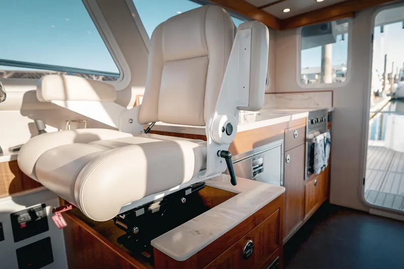 Slide: The Image of Luxurious interior of 2027 Lindell 42' yacht featuring a plush captain's chair. - 29