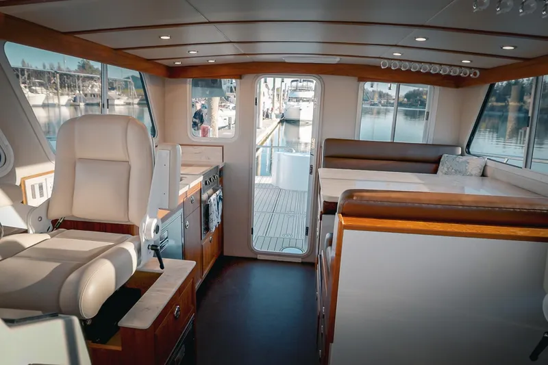 Slide: The Image of Luxurious interior of 2027 Lindell 42' yacht with elegant seating and panoramic windows. - 30