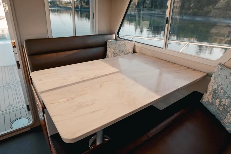 Slide: The Image of Elegant interior of 2027 Lindell 42' yacht with marble table and plush seating. - 32