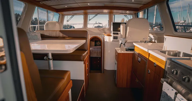 Slide: The Image of 2027 Lindell 42' yacht docked, featuring spacious deck and sleek design in Kingston, WA. - 9