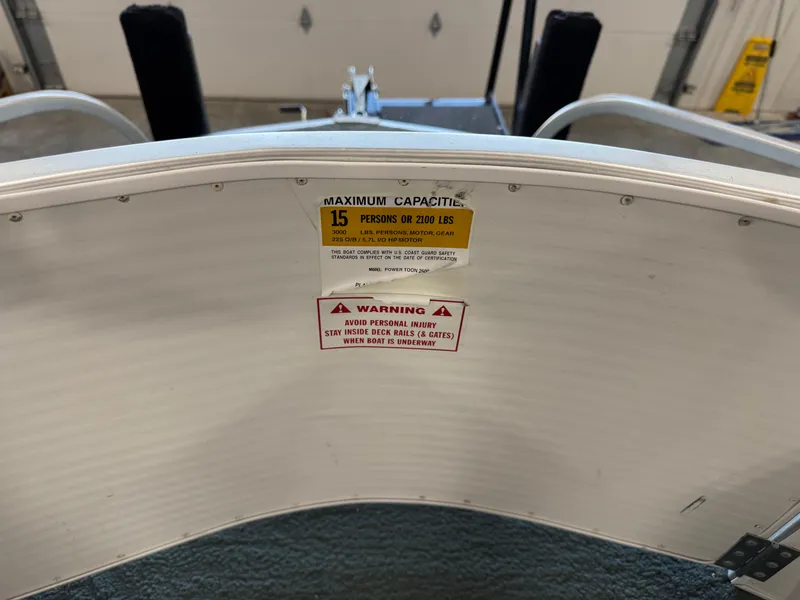 Slide: The Image of 2001 PlayCraft 2600 Powertoon boat capacity warning label, 15 persons or 2100 lbs. - 13