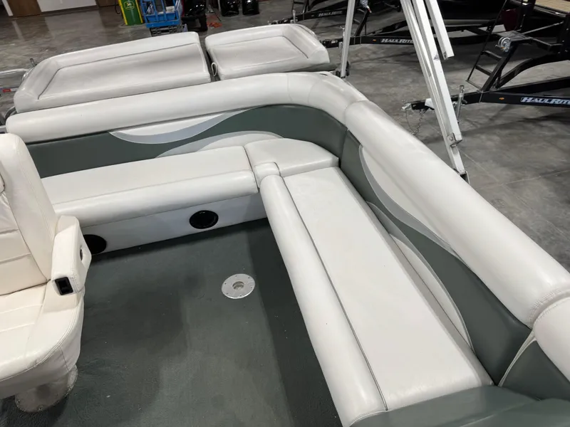 Slide: The Image of 2001 PlayCraft 2600 Powertoon boat interior with white and gray seating. - 7