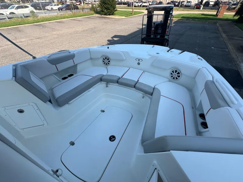 Slide: The Image of 2020 Tahoe 2150 CC boat interior with spacious seating and cup holders. - 13