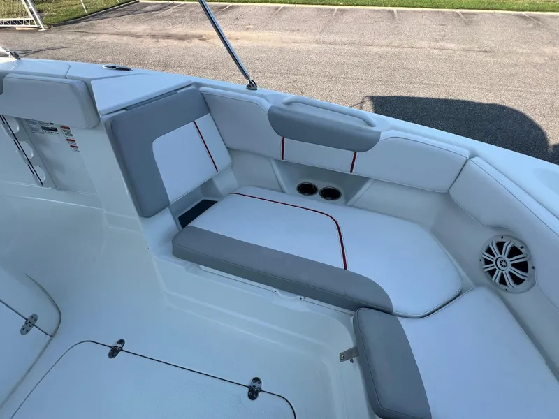 Slide: The Image of 2020 Tahoe 2150 CC boat interior with cushioned seating and speaker. - 15