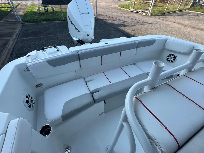 Slide: The Image of 2020 Tahoe 2150 CC boat interior with white seating and Mercury outboard motor. - 26