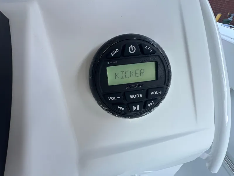 Slide: The Image of Kicker audio system on 2020 Tahoe 2150 CC boat dashboard. - 27