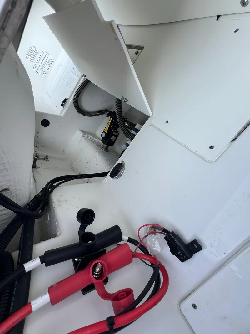 Slide: The Image of 2020 Tahoe 2150 CC boat interior showing wiring and compartments. - 30