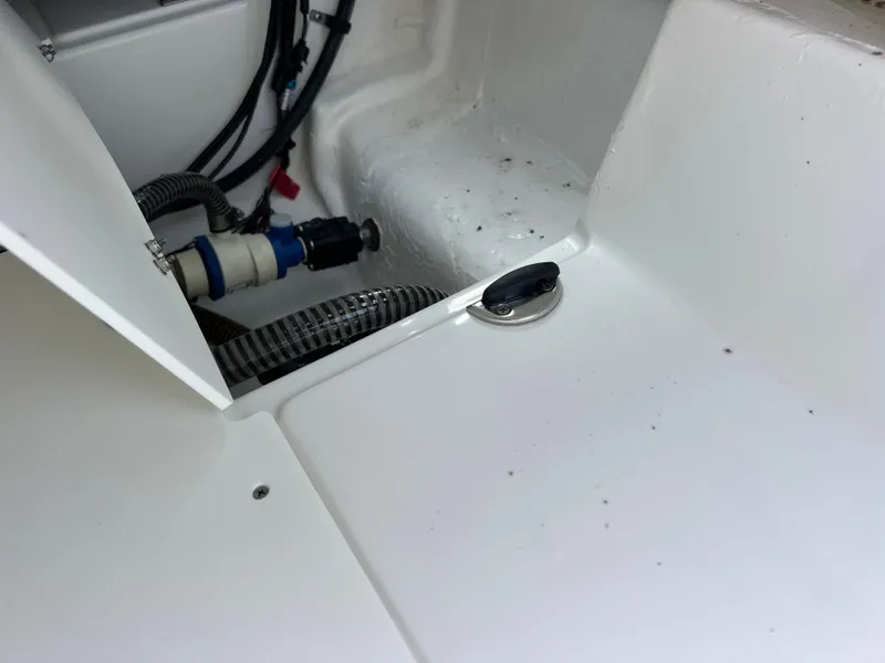 Slide: The Image of 2020 Tahoe 2150 CC boat interior showing wiring and components. - 32