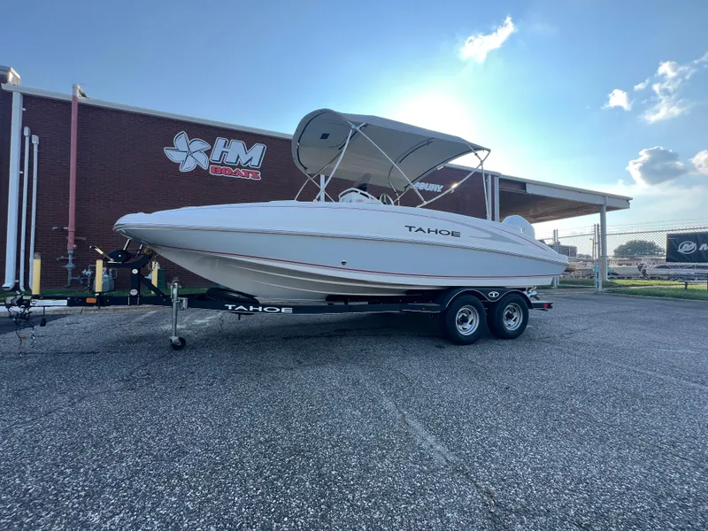 Slide: The Image of 2020 Tahoe 2150 CC boat on trailer outside HM Boats building. - 5