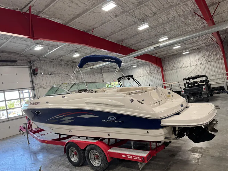 Slide: The Image of 2005 Chaparral 260 SSi boat on red trailer in indoor storage facility. - 4
