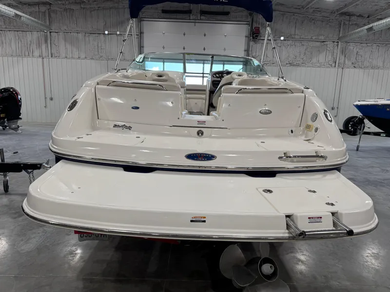 Slide: The Image of 2005 Chaparral 260 SSi boat in a garage, rear view with swim platform. - 5