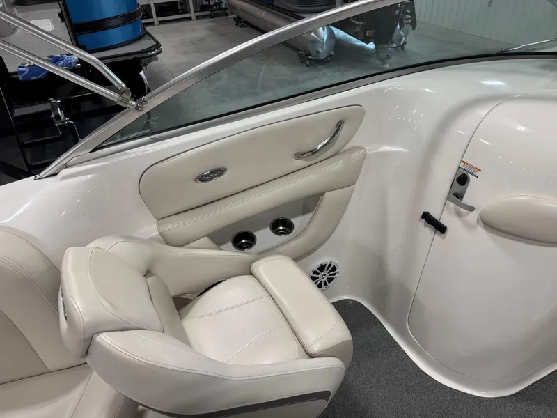 Slide: The Image of 2005 Chaparral 260 SSi boat interior with white leather seating and chrome accents. - 8