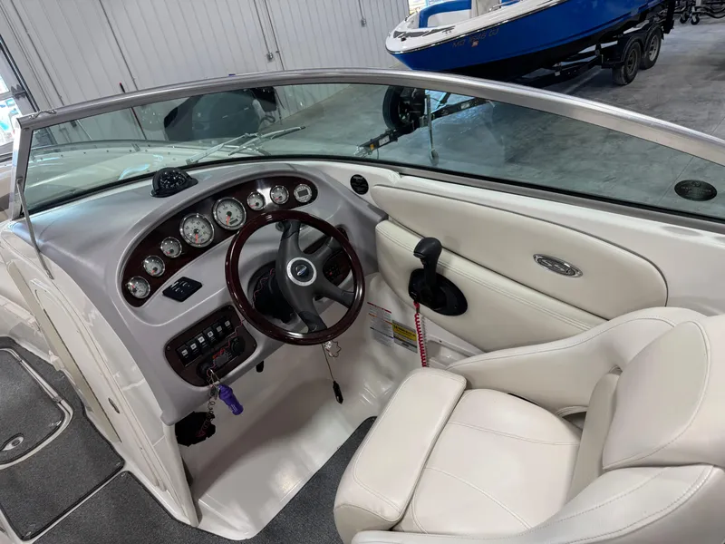 Slide: The Image of 2005 Chaparral 260 SSi boat interior with steering wheel and dashboard controls. - 9