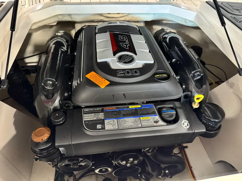 Slide: The Image of 2018 Chaparral 21 H2O boat engine, featuring a Mercury 4.5L 200 horsepower motor. - 13