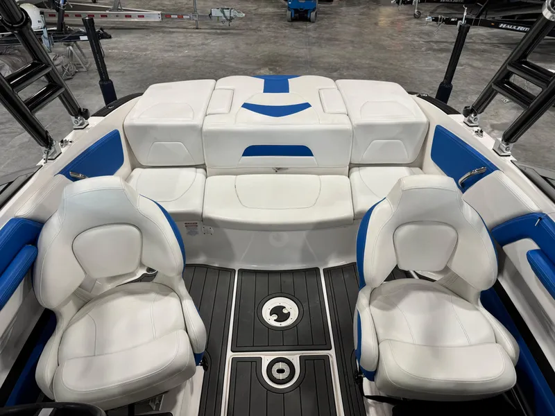 Slide: The Image of 2018 Chaparral 21 H2O boat interior with white and blue seating. - 7