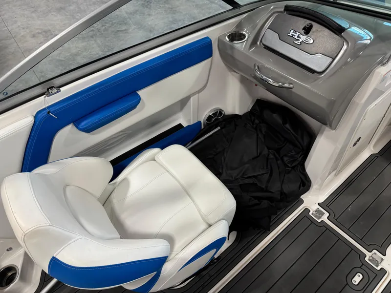 Slide: The Image of 2018 Chaparral 21 H2O boat interior with white and blue seating. - 9