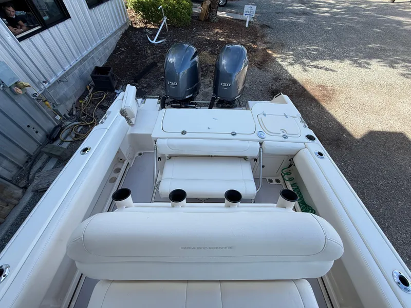 Slide: The Image of 2020 Grady-White Fisherman 257 boat with dual 150 horsepower engines, docked outdoors. - 14