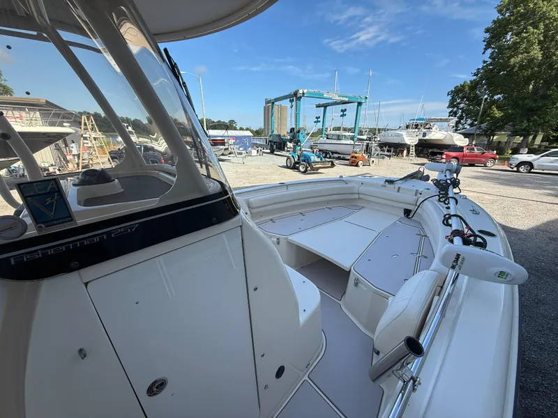 Slide: The Image of 2020 Grady-White Fisherman 257 boat at marina, showcasing spacious deck and modern design. - 17